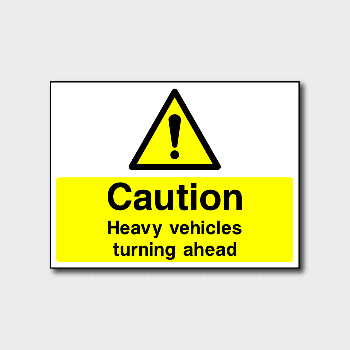 Caution Heavy Vehicles Turning Ahead Sign