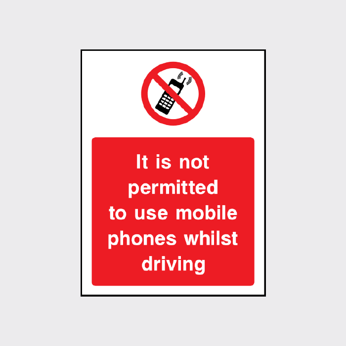 It is not permitted to use mobile phones whilst driving sign