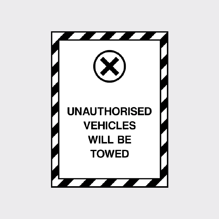 Unauthorised vehicles will be towed sign