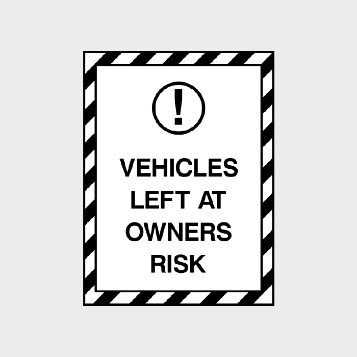 Vehicles left at owners risk sign