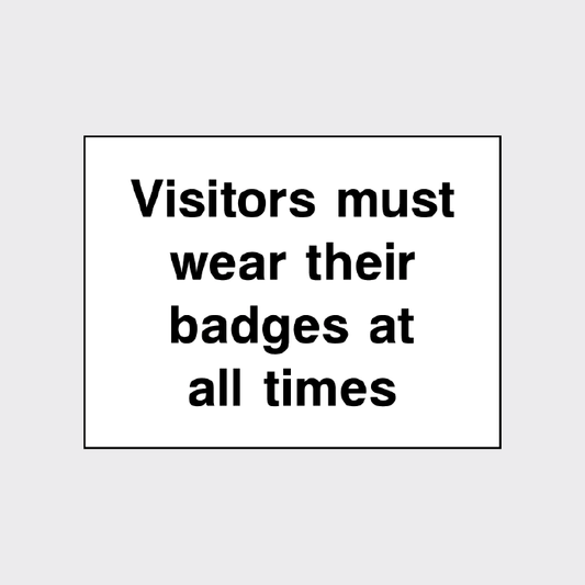 Visitors must wear their badges at all times sign